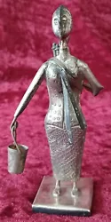 Buy Vintage Unusual African Art,  Metal Lady Holding Two Buckets - One On Her Back • 45£